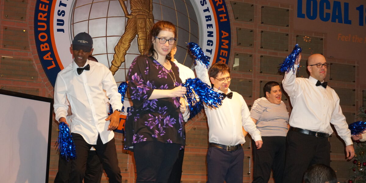 Five Luso Participants performing a dance on a stage at our Annual Celebration of Abilities Event. Special Needs Disability Hamilton Mississauga Toronto
